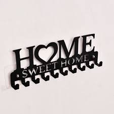 A metal "Home Sweet Home" wall-mounted key holder with 10 hooks - Black